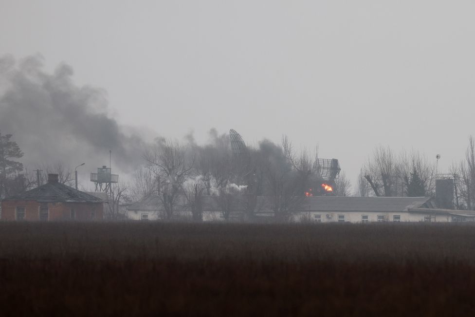 Smoke is seen coming out of a military installation near the airport, after Russian President Vladimir Putin authorized a military operation in eastern Ukraine, in Mariupol, 24 February 2022