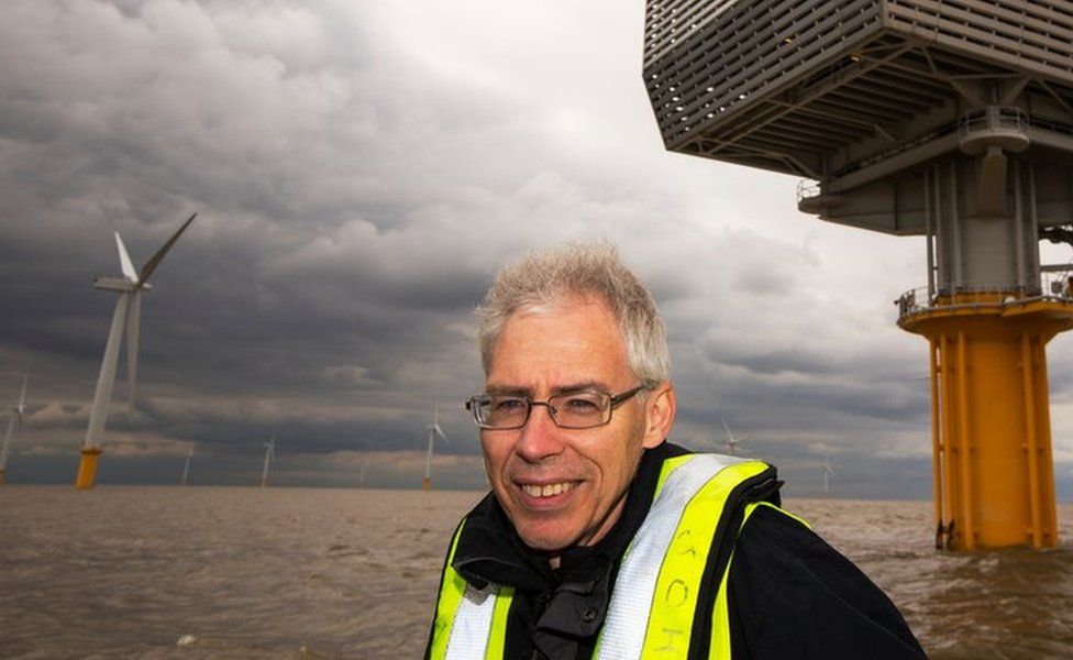 Doug Parr in front of windfarm