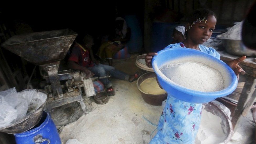 A girl is seen with millet flour at Adjame's market in Abidjan, Ivory Coast, 2 October 2015