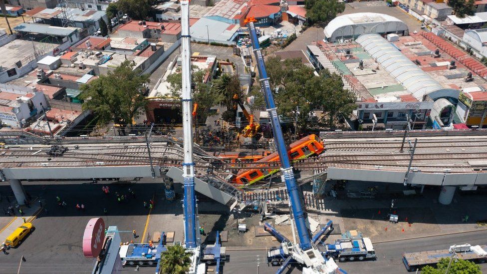 Aerial view of the works to remove the damaged train after a train overpass collapsed last night killing 23 people on May 04, 2021 in Mexico City, Mexico