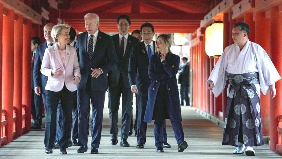 G7 leaders walk with a priest at a shrine in Hiroshima, Japan. Photo: 19 May 2023