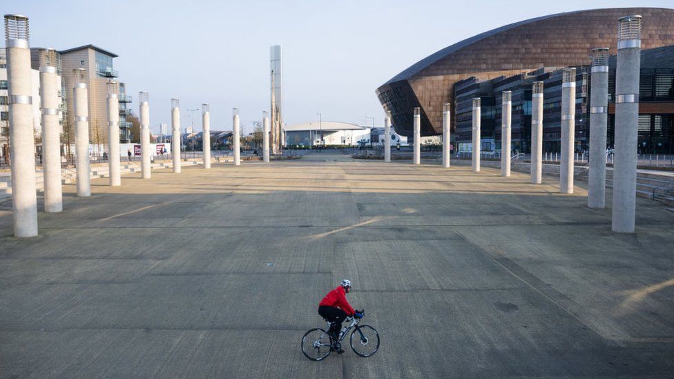 Man on bicycle in Cardiff Bay