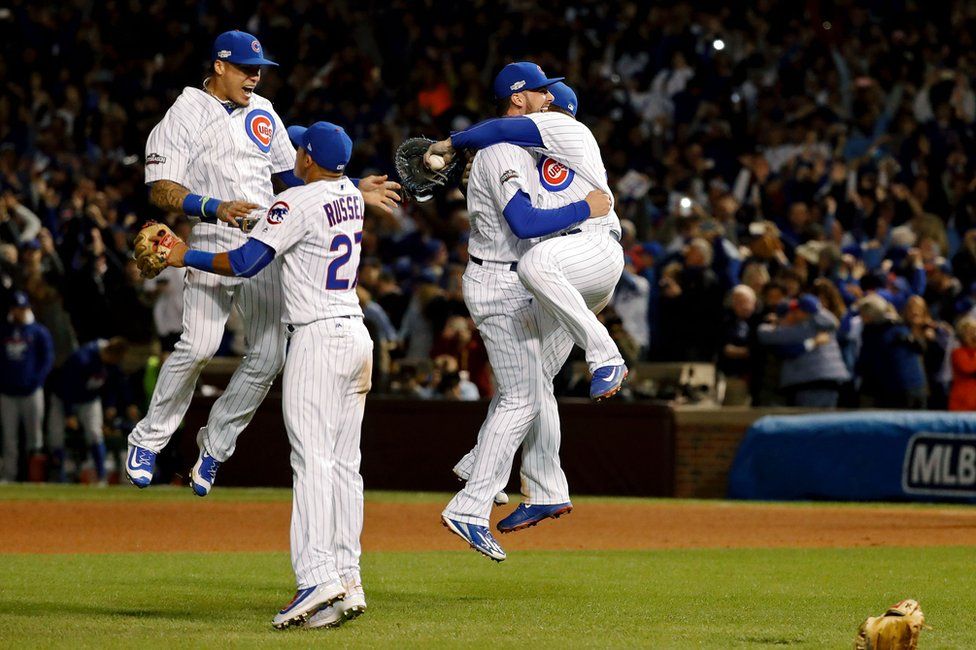 The Chicago Cubs celebrate after winning Game 6 of the 2016 NLCS playoff baseball series at Wrigley Field, 22 October