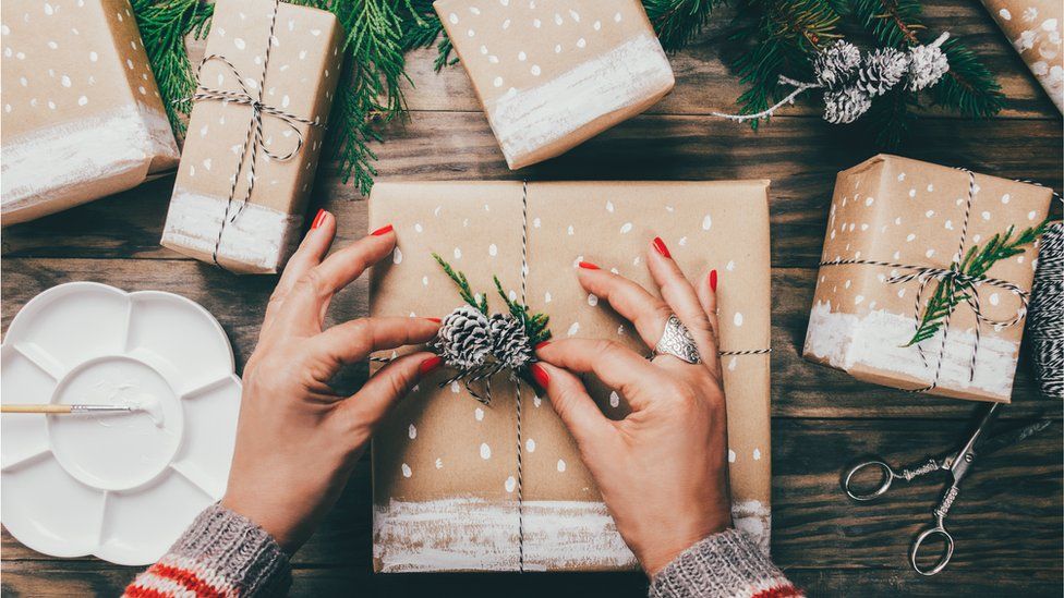 Gifts wrapped in decorated brown paper