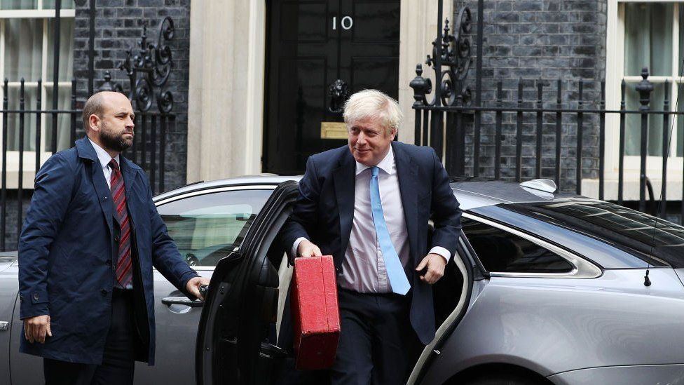 Boris Johnson getting out of a car outside 10 Downing Street