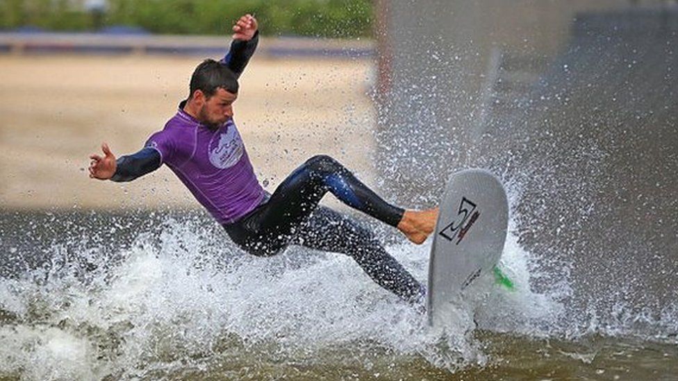 DOLGARROG, WALES - AUGUST 05: Senior Instructor Rick Velk rides a wave at Surf Snowdonia on August 5, 2016 in Dolgarrog, Wales. Surf Snowdonia is the world's first inland surf lagoon featuring pioneering technology which has made an Olympic dream a reality for British surfers. The International Olympic Committee (IOC) has announced its decision to include surfing in the Tokyo 2020 Olympics. The lagoon creates a perfect wave for surfers and was central to the inclusion of surfing in the Olympic Games. Surf Snowdonia will be crucial training facility for first ever surfing Team GB. (Photo by Christopher Furlong/Getty Images)