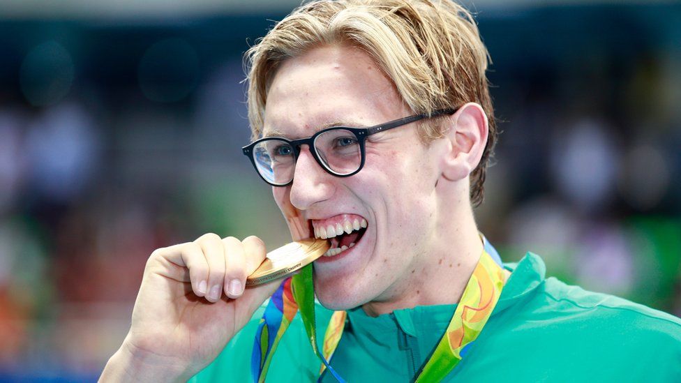 Australian swimmer Mack Horton shows off his Olympic gold medal