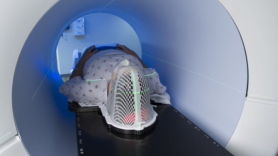 Patient receiving a scan for head and neck cancer