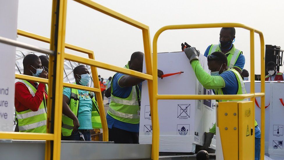 Airport workers loading Covid-19 vaccines at the Kotoka International Airport in Accra