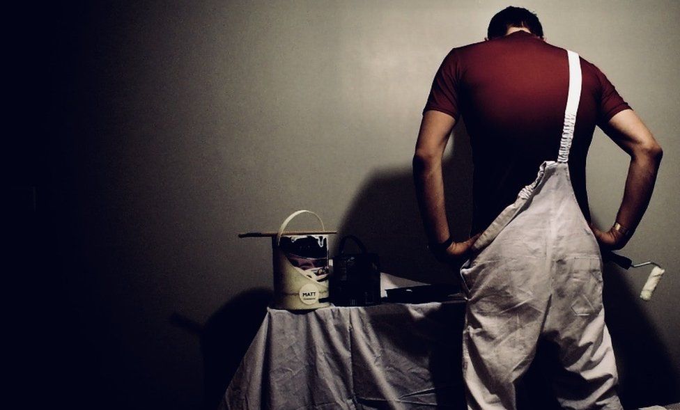 A painter prepares his tools