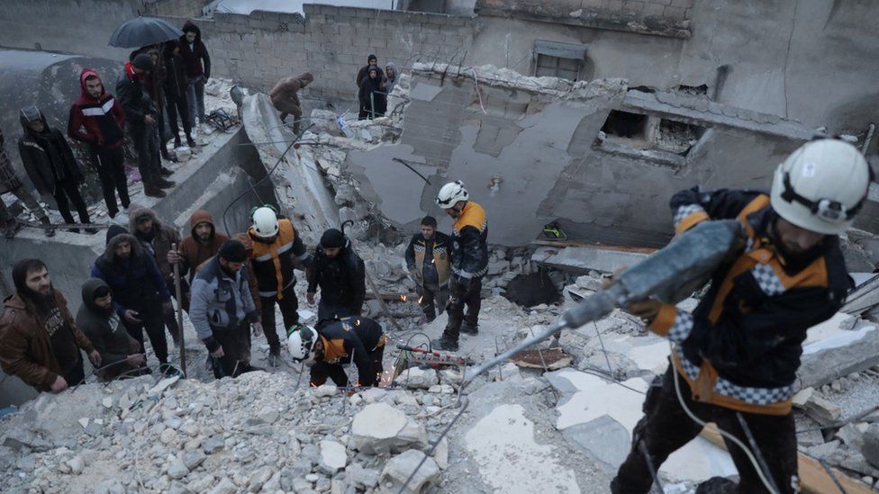 Rescuers searching for survivors under the rubble