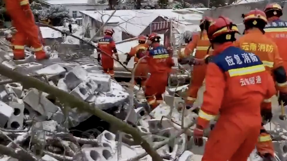 Rescue workers in Zhenxiong county are working in sub-zero temperatures