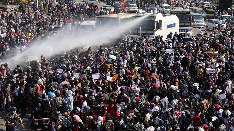 Police fire a water cannon at protesters demonstrating against the coup and to demand the release of elected leader Aung San Suu Kyi, in Naypyitaw, Myanmar, February 8, 2021.