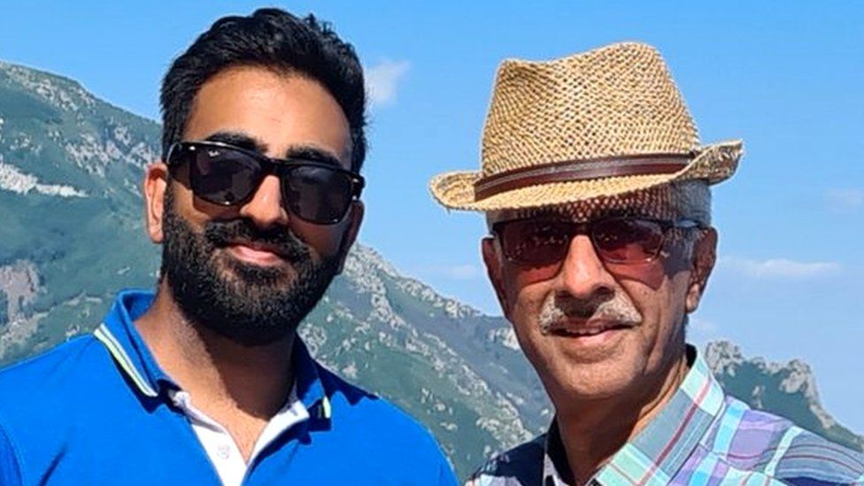 Sanjay Dattani and his dad Sunil in front of a mountain