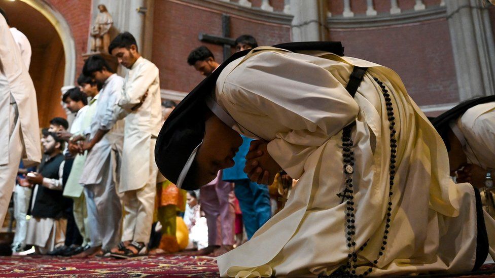 Catholic faithful offer prayers on Easter Sunday commemorating the resurrection of Jesus as part of the Holy Week celebrations at the Sacred Heart Cathedral in Lahore