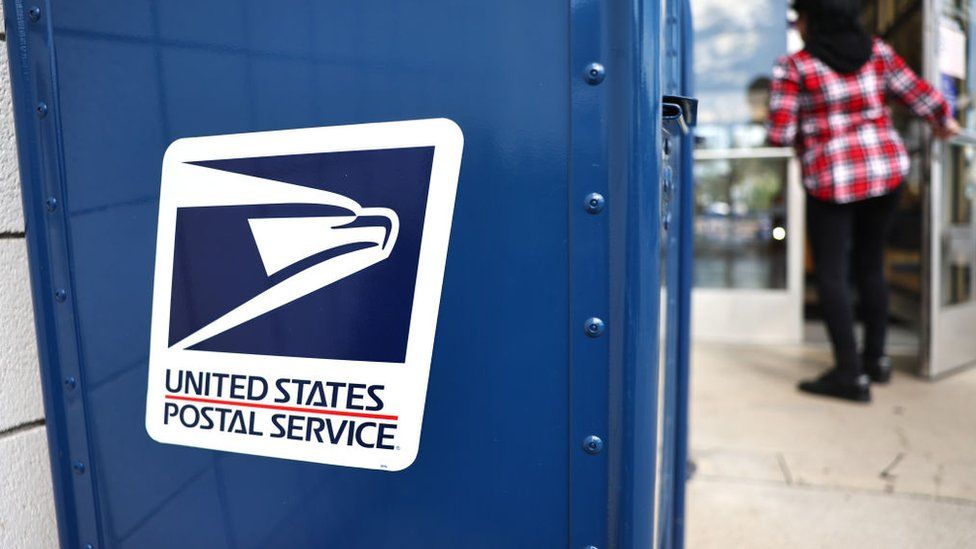 A United States Postal Service logo is displayed on a U.S. Post Office mailbox on April 1, 2024 in Montclair, California.