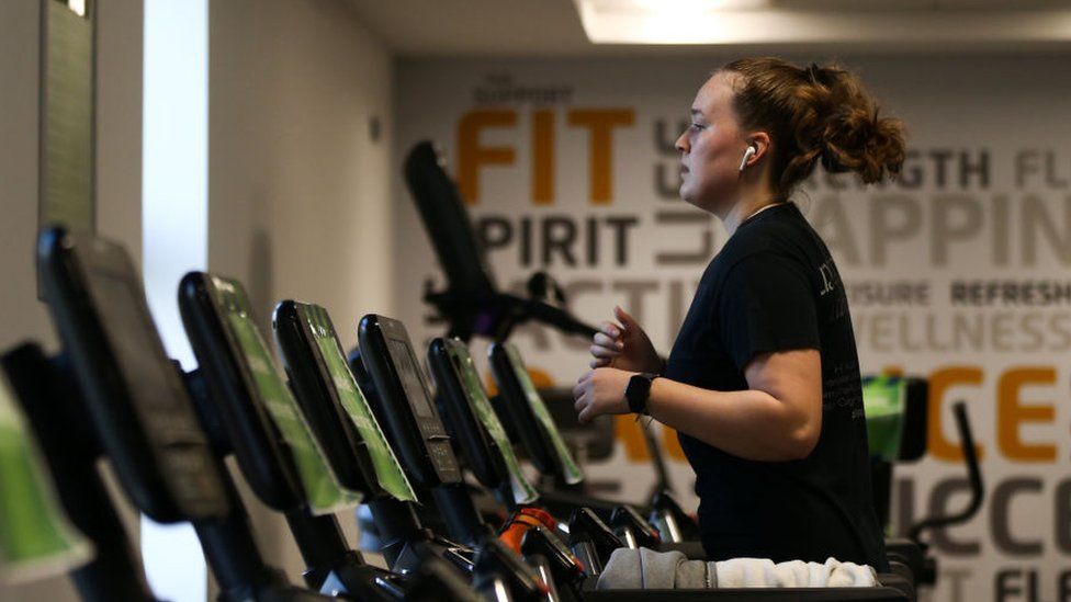 Woman exercising on a treadmill.