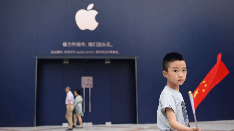 Boy outside an Apple store