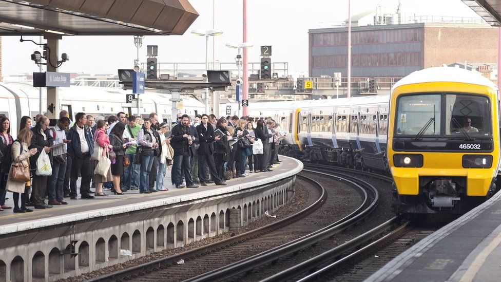 train pulling into crowded station