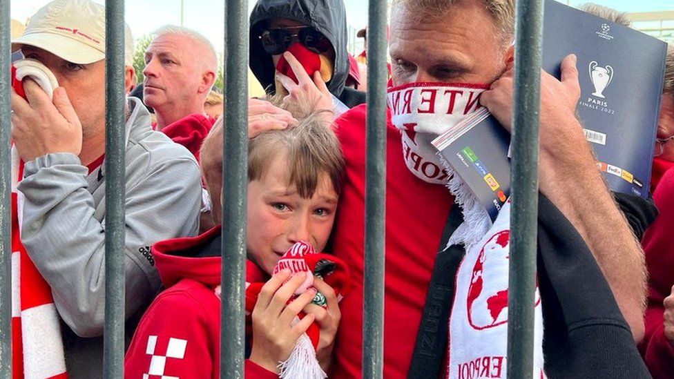 Liverpool fans queue to access the Stade de France stadium in Paris before the Champions League final, 28 May 2022