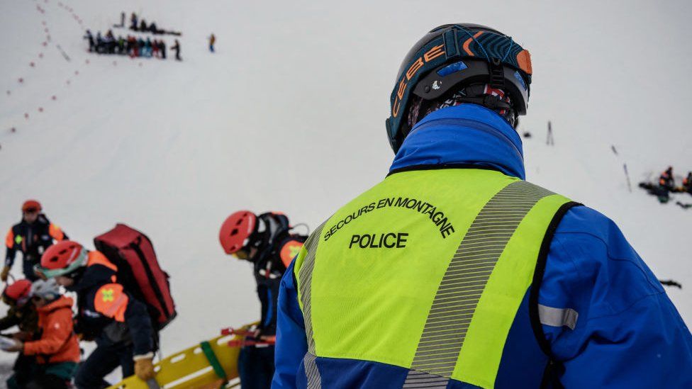 A high mountain rescue police officer takes part in a search and rescue exercise for avalanche victims in the French Alps