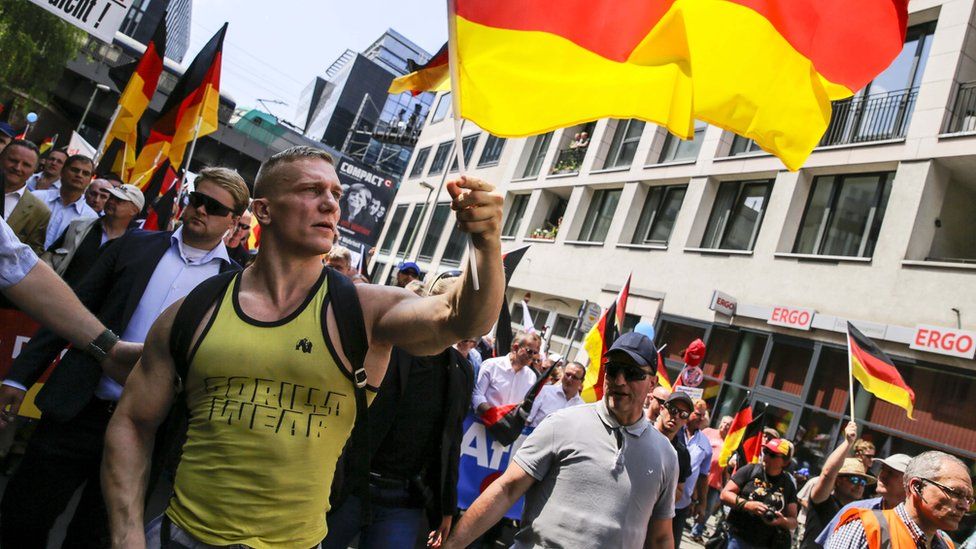 A protester waves the German flag during the right-wing AfD Alternative for Germany political party demonstration titled "Future Germany" on May 27, 2018 in Berlin, Germany.
