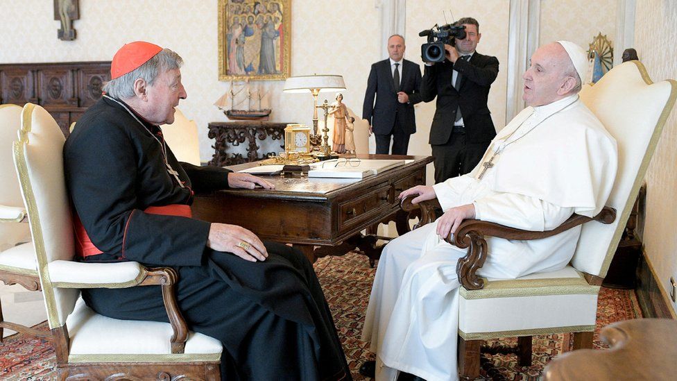 George Pell speaks with Pope Francis