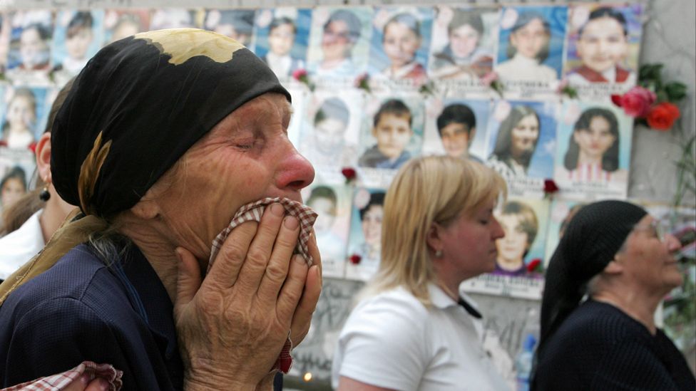 Women cry during a memorial ceremony for those who died in the 2004 Beslan attack