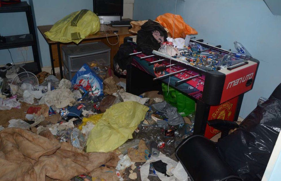 Bedroom with rubbish strewn everywhere
