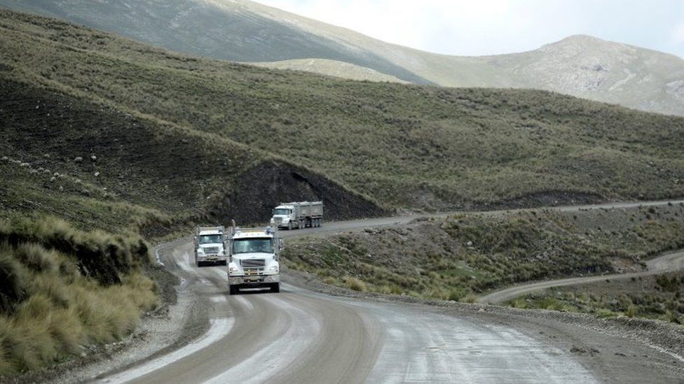 Trucks from the Las Bambas mine circulate along the mining corridor between Sayhua and Capacmarca, near Capacmarca, Peru, January 19, 2022. Picture taken January 19, 2022.