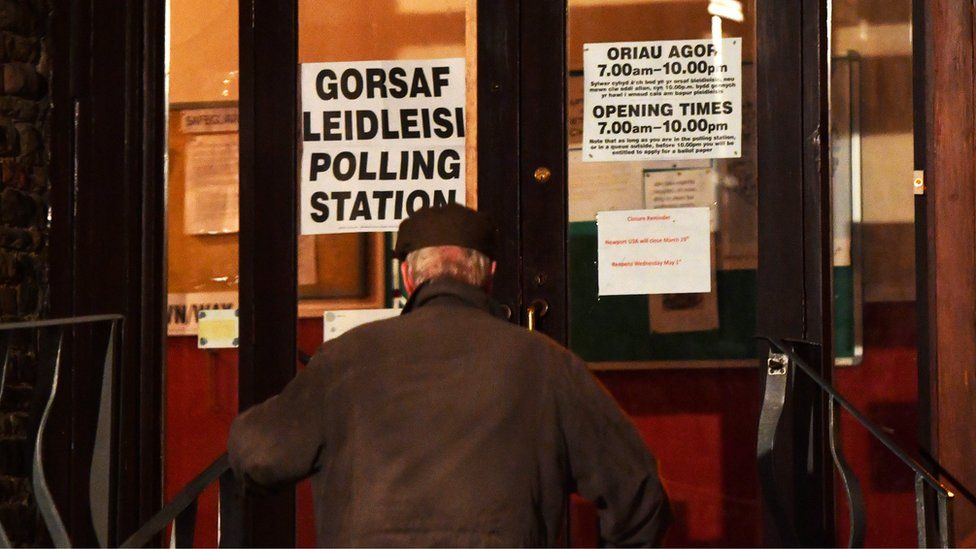 man entering polling station