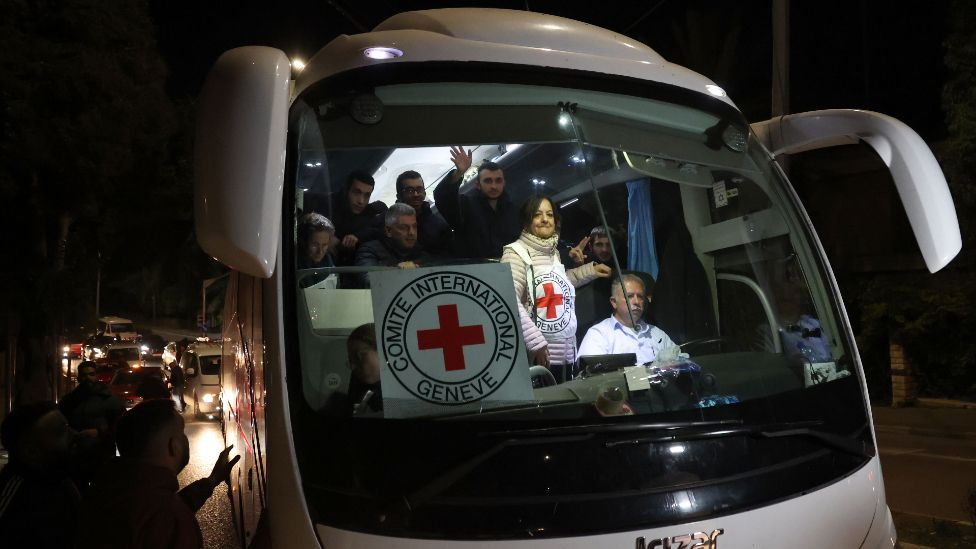 A bus of the Red Cross transferring released Palestinian prisoners from the Ofer Israeli military prison arrives in Ramallah