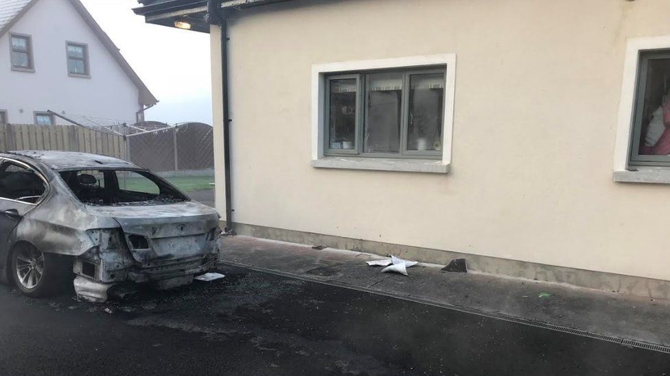The car was set on fire outside the family's bedroom