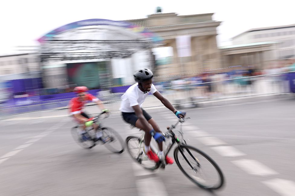 Kennedy Munyao (R) of Kenya competes with Odai Deirawan of Syria at the Brandenburg Gate during day nine of Special Olympics World Games Berlin 2023 in Berlin Germany - Sunday 25 June 2023