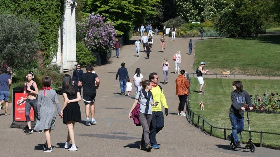 People walking in Kensington Gardens, in London, on Saturday 25 April