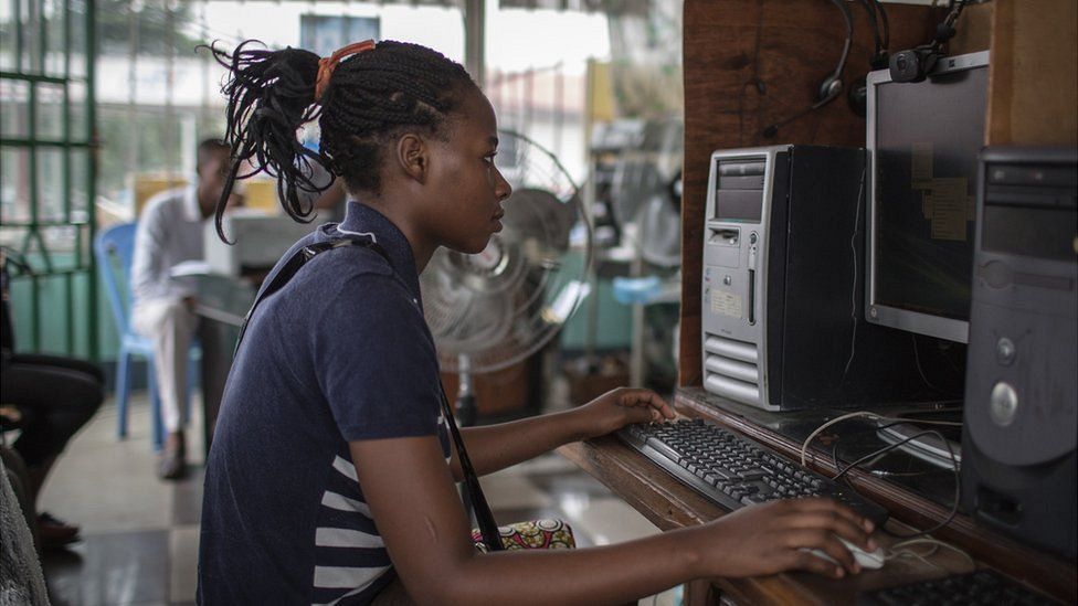 A girl in the Democratic of Congo on a computer