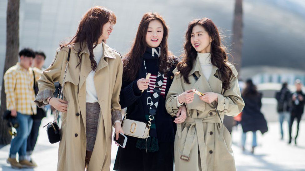 Models wearing trench coat seen at the Hera Seoul Fashion Week 2018