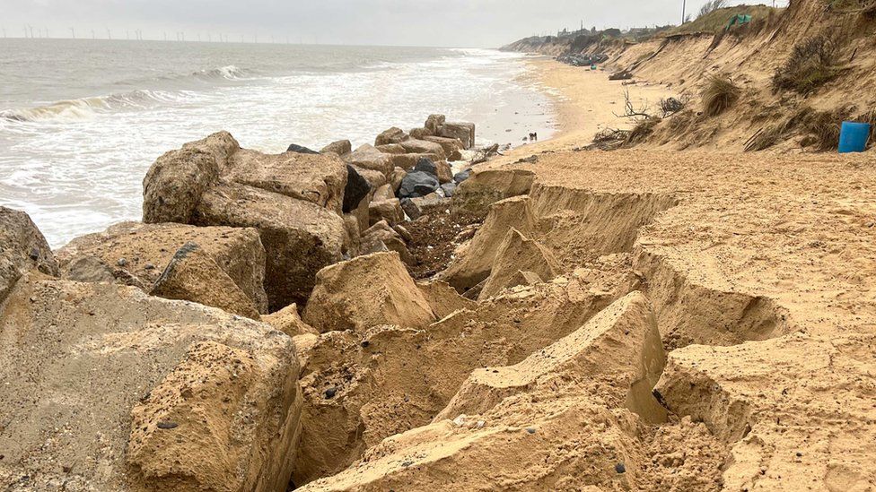 View down the beach at Hemsby showing the retaining rocks on the left and the access ramp on the right