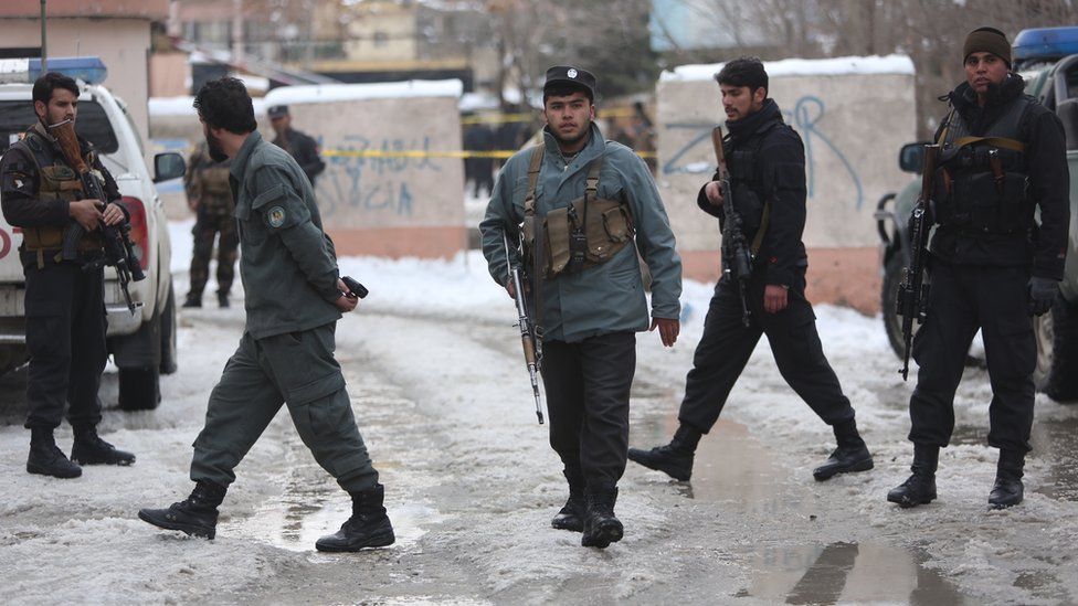 Police officers inspect the site of suicide attack at the Supreme Court in Kabul, Afghanistan on 7 February 2017