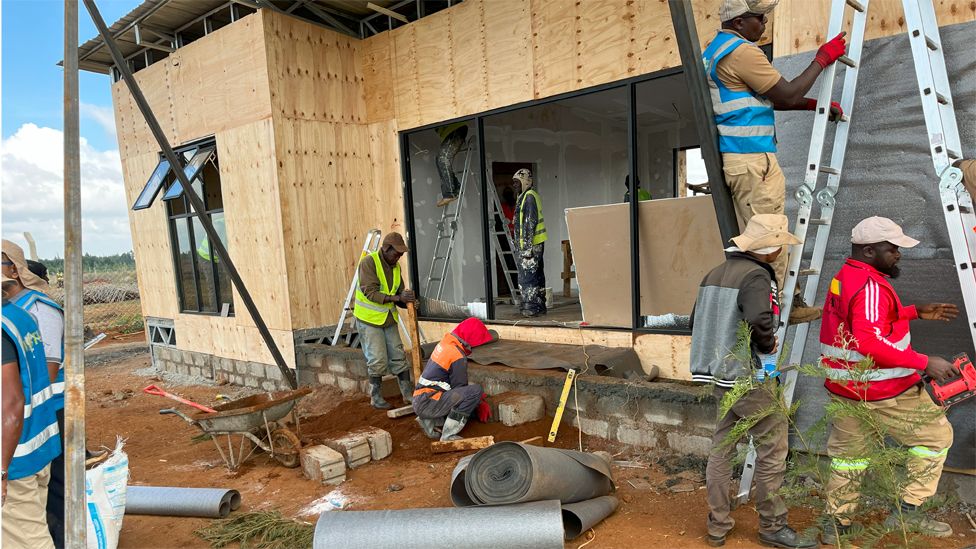 Workers building a house for Kelvin Kiptum's family in Chepsamo