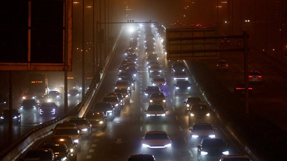 Cars caught in gridlock in the middle of a sandstorm in Beijing, China.