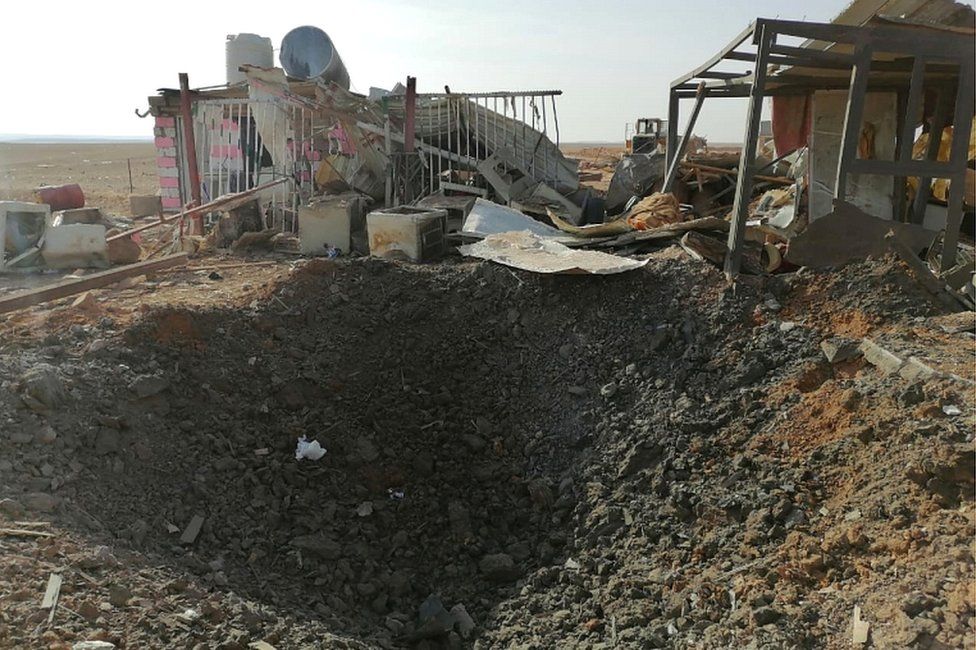 A hole left after an air strike at the headquarters of the Kataib Hezbollah militia group in Qaim, Iraq, on 30 December 2019