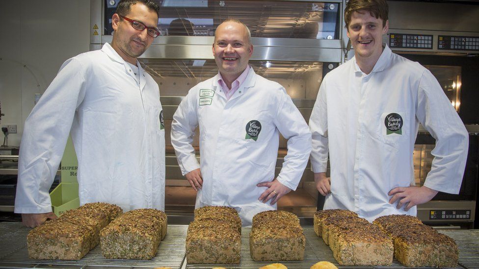 Village Bakery operations director, Simon Thorpe (centre) with apprentice bakers Bilei Mejbri and Jac Griffiths