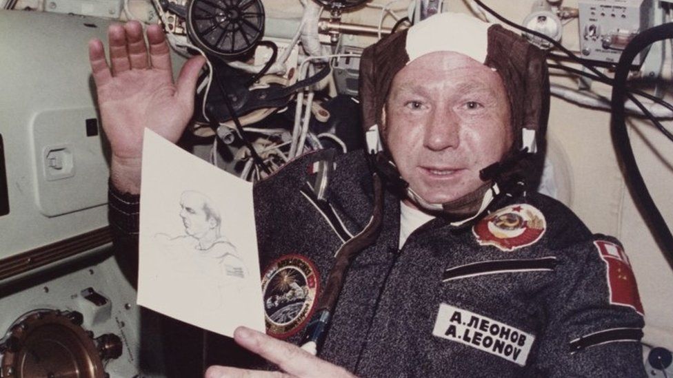 Alexei Leonov holds a sketch he drew during the joint US-USSR Apollo-Soyuz mission in 1975