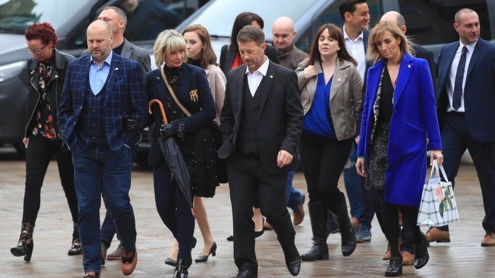 Victims Chris Unsworth (front left) and Steve Walters (front right) arrive at Liverpool Crown Court for the sentencing