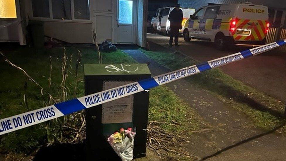 Police tape outside a house where a child died in a dog attack in Milton Keynes