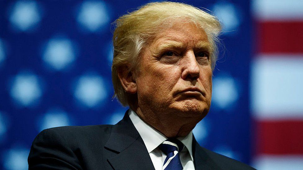 Donald Trump stands at a rally in Michigan.