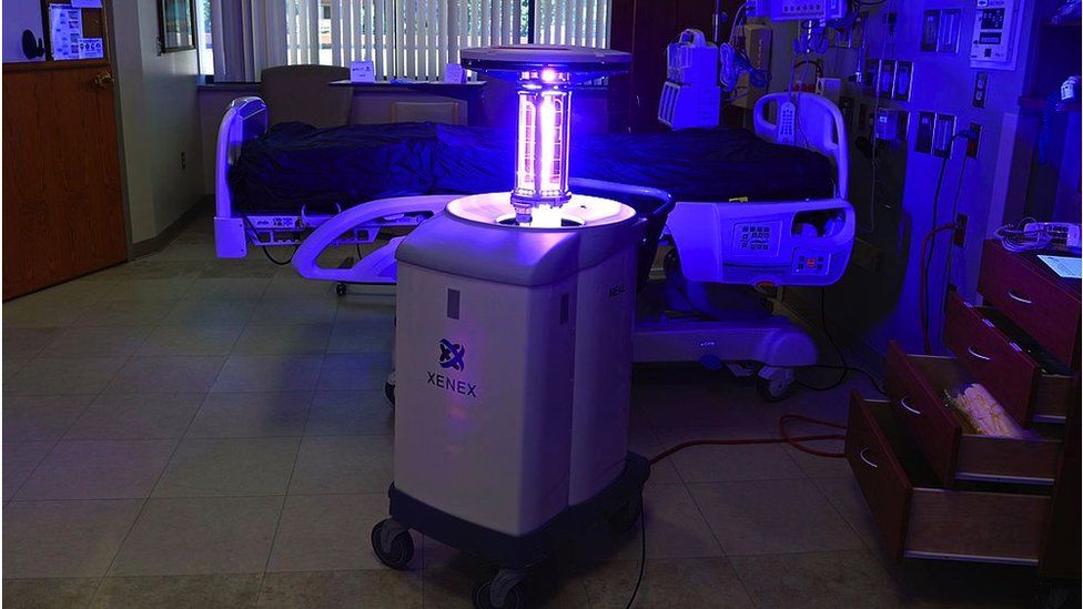 A hospital room in the US being cleaned with UV lights