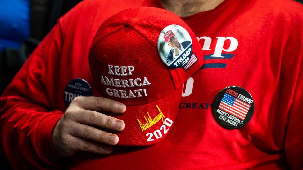 A supporter holds his hat to his chest during the national anthem before a campaign rally for President Donald Trump on January 9 in Ohio