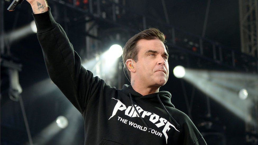 Robbie Williams performing in 2017